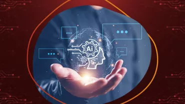 Hand hält leuchtendes AI-Symbol mit digitalen Kommunikationssymbolen.