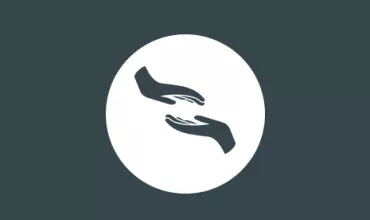 Symbol von zwei einander zugewandten Händen auf dunklem Hintergrund.